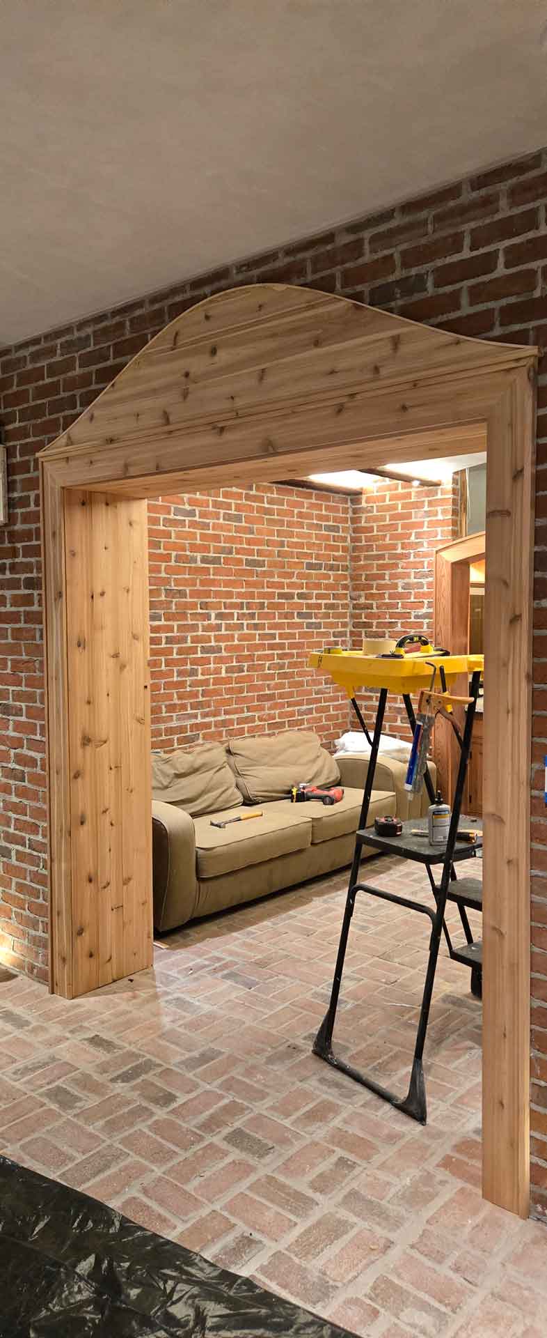 New decorative wooden arch installed in wine cellar by Dream Space Renovation LLC